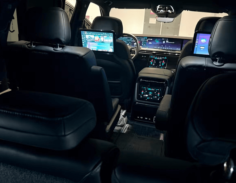 Backseat view of high-tech vehicle dashboard